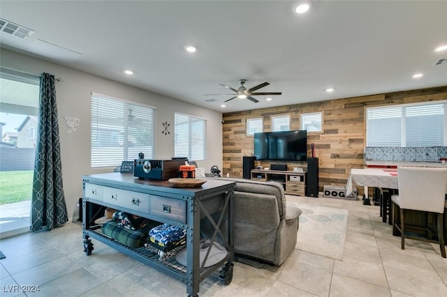 4323 Creekside Cavern Ave, North Las Vegas, NV 89084 - living area with wood walls, recessed lighting, a ceiling fan, and light tile patterned floors