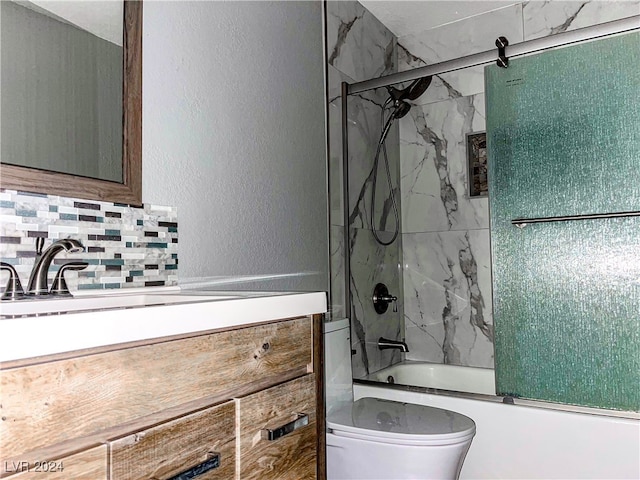 full bathroom with decorative backsplash, toilet, bath / shower combo with glass door, and vanity