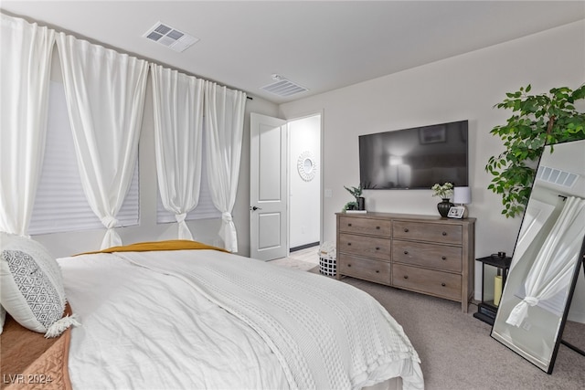 bedroom featuring light carpet