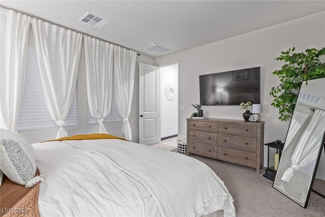 carpeted bedroom with visible vents