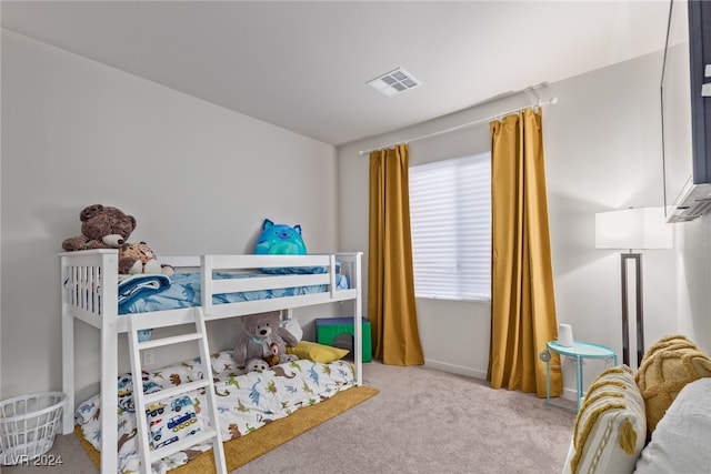 bedroom with light colored carpet