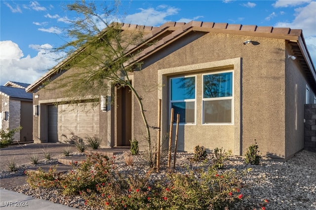 view of home's exterior with a garage