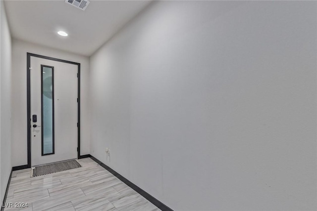 entrance foyer with baseboards, recessed lighting, and visible vents