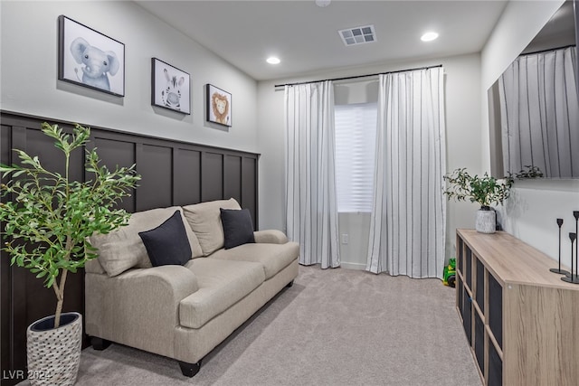 living room with light colored carpet