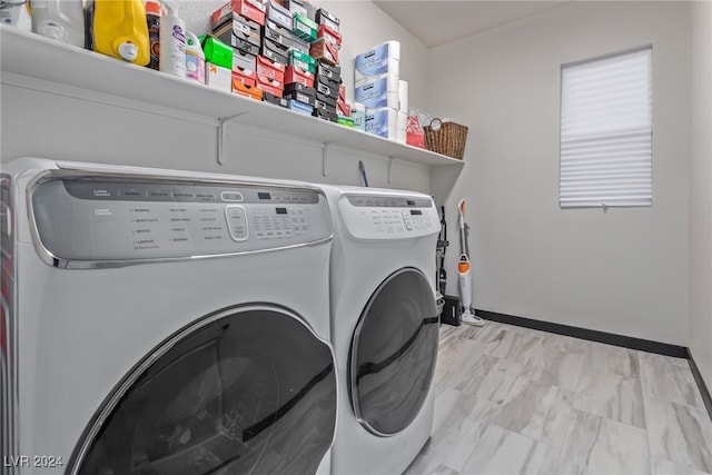 clothes washing area featuring separate washer and dryer