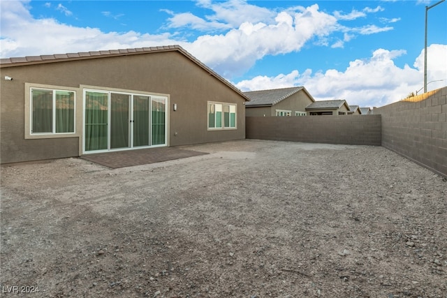 rear view of house with a patio