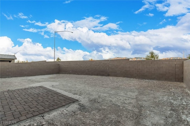 view of yard featuring a fenced backyard and a patio area