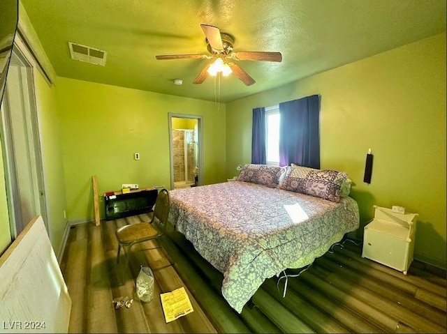 bedroom featuring ceiling fan and dark hardwood / wood-style flooring