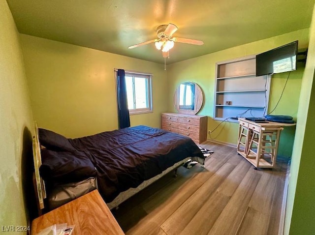 bedroom with hardwood / wood-style flooring and ceiling fan