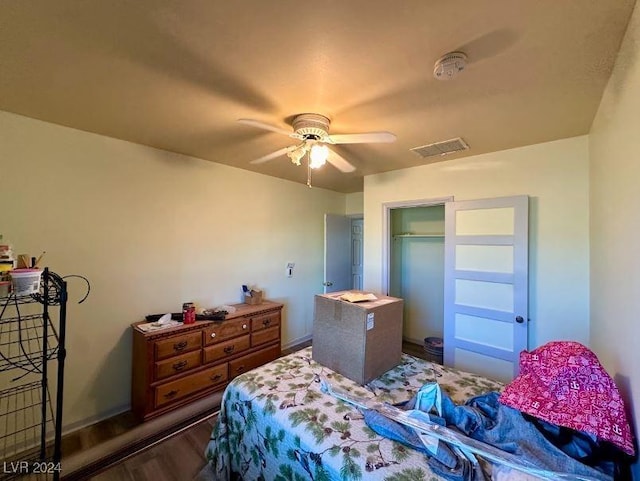 bedroom featuring ceiling fan and dark hardwood / wood-style floors