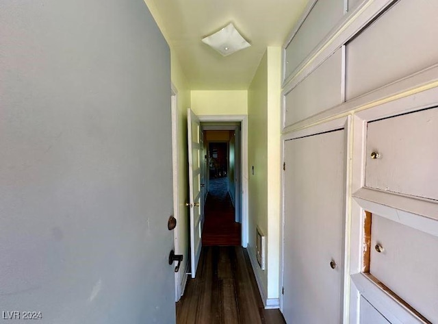 hallway with dark wood-type flooring