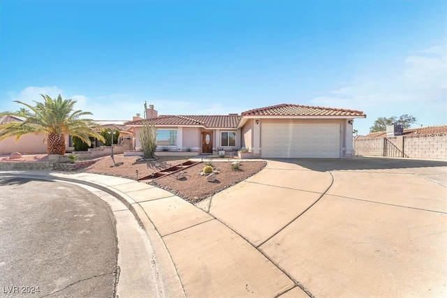 mediterranean / spanish-style house featuring a garage