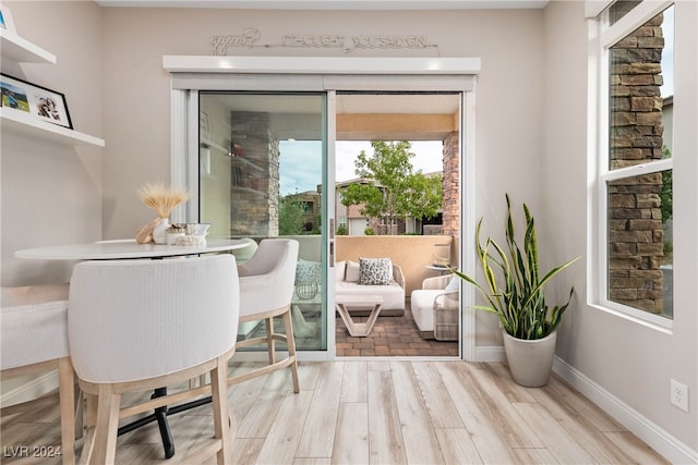 living area with light hardwood / wood-style flooring