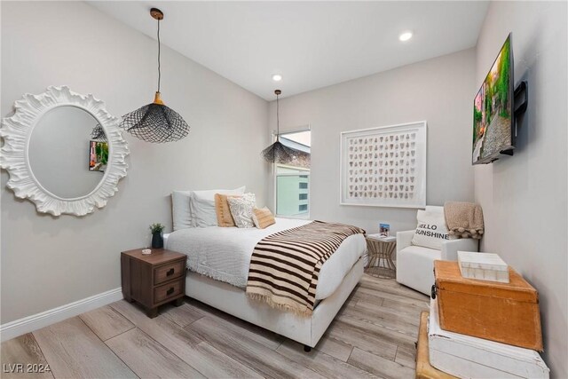 bedroom with light wood-type flooring