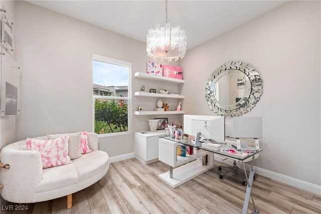 office featuring light hardwood / wood-style flooring and a chandelier