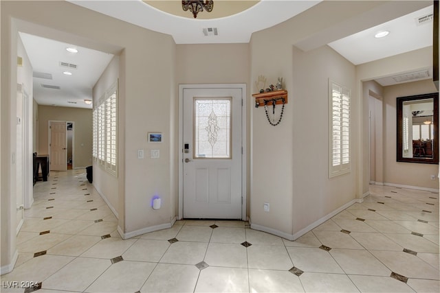 foyer featuring light tile patterned floors