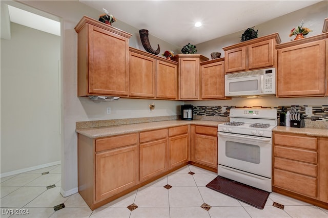 kitchen featuring white appliances and light tile patterned floors