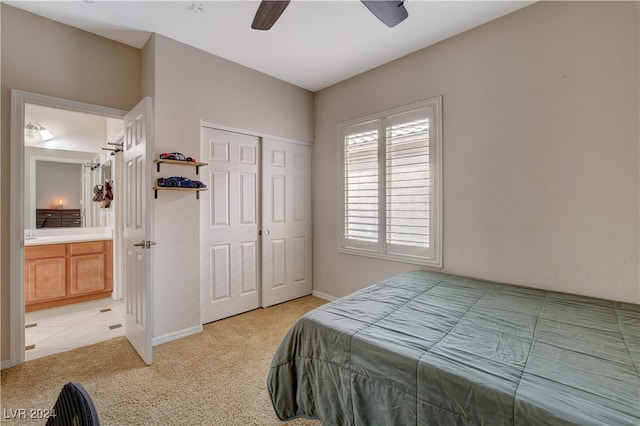 bedroom with light carpet, a closet, and ceiling fan