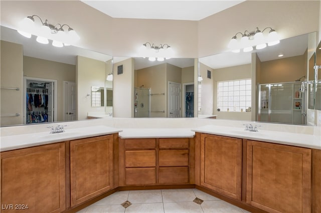 bathroom featuring vanity, an enclosed shower, and tile patterned flooring