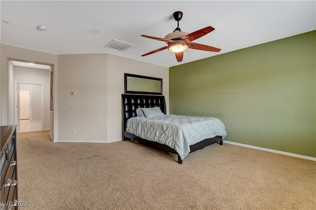 bedroom with light colored carpet and ceiling fan