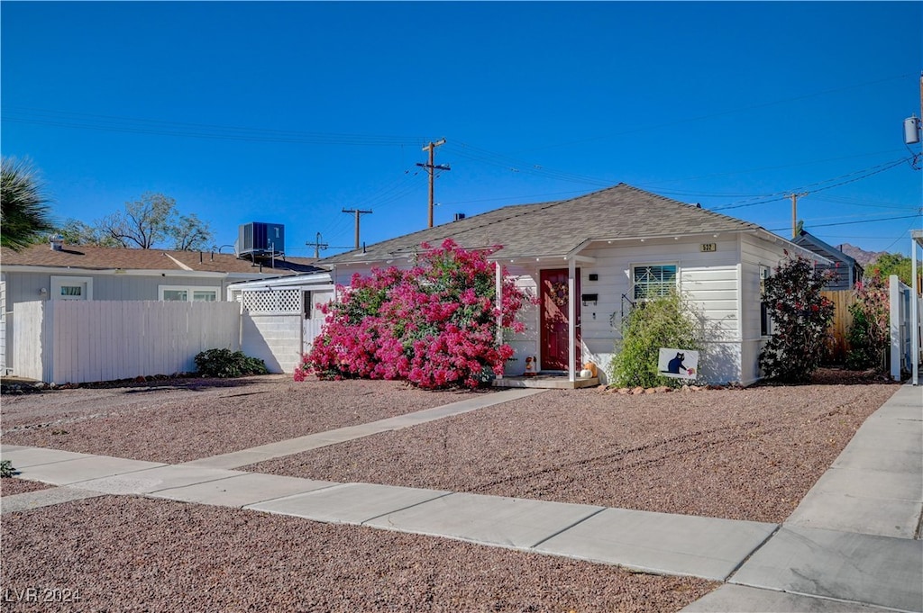 ranch-style home with central AC unit