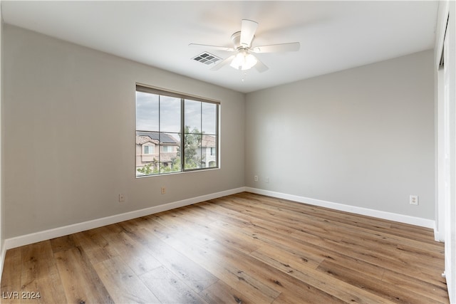 empty room featuring light wood-type flooring and ceiling fan