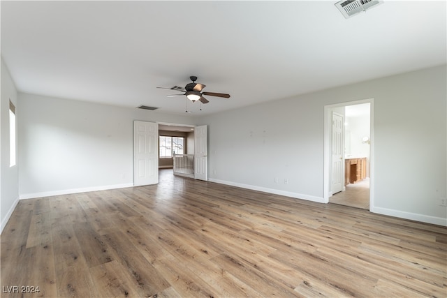 empty room featuring ceiling fan and light hardwood / wood-style floors