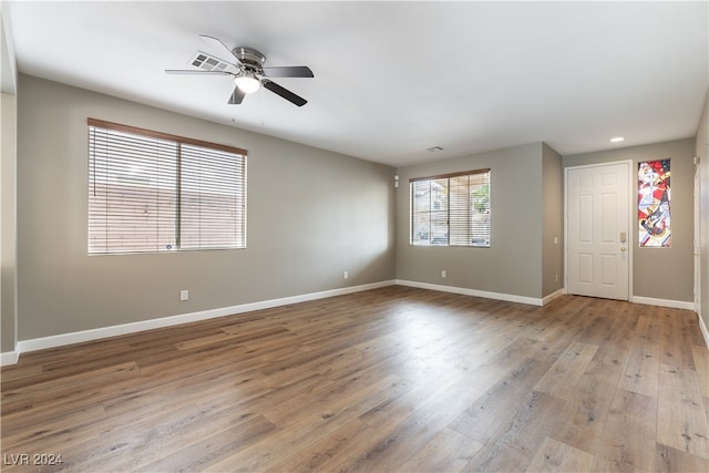 spare room featuring ceiling fan and light hardwood / wood-style floors