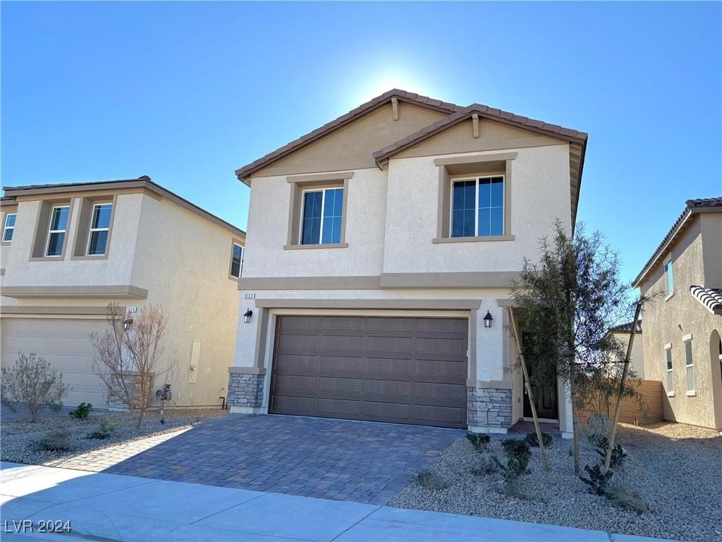 front of property with a garage