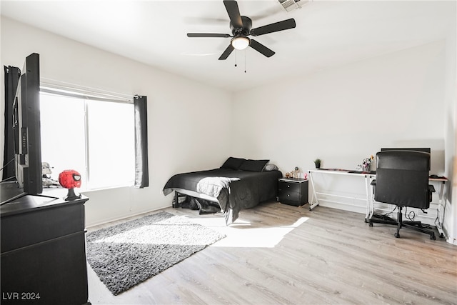 bedroom featuring light hardwood / wood-style flooring and ceiling fan