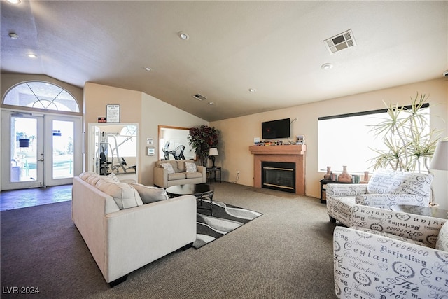 living room featuring dark carpet, lofted ceiling, and french doors