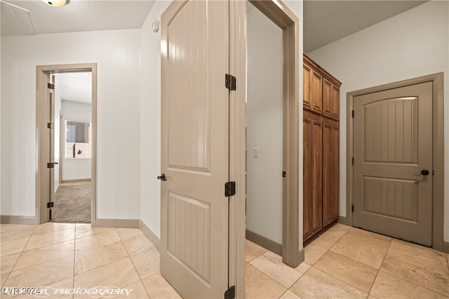 corridor featuring a textured ceiling