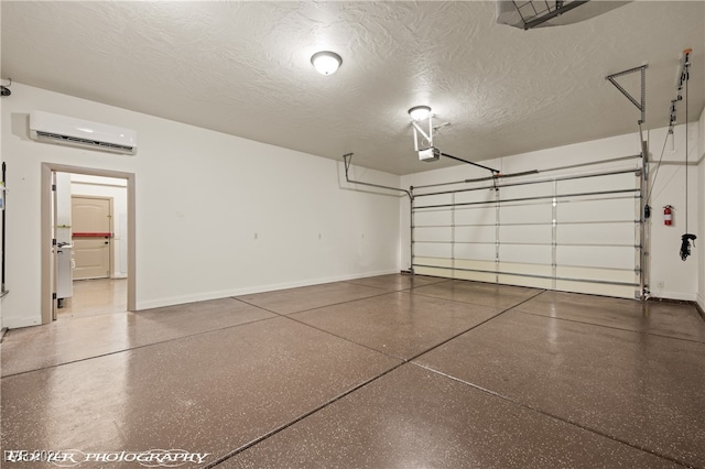 garage featuring an AC wall unit and a garage door opener