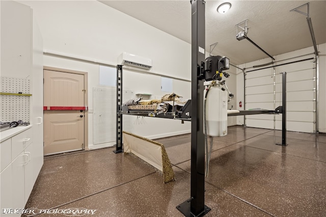 garage featuring a wall mounted air conditioner