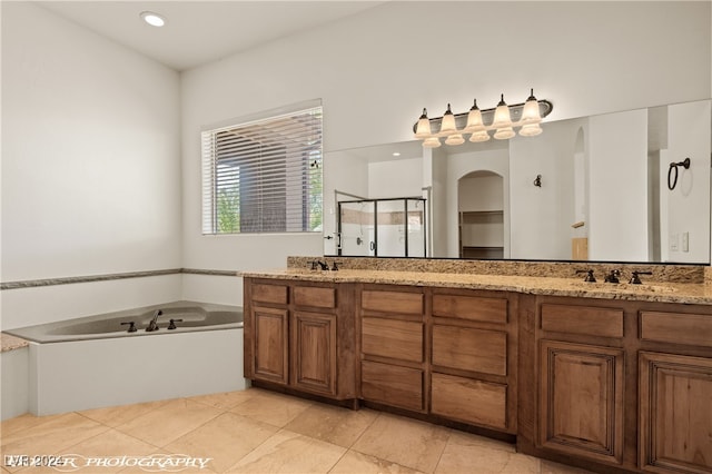 bathroom featuring vanity, tile patterned floors, and separate shower and tub