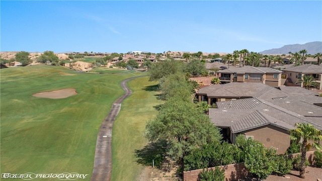 birds eye view of property with a mountain view