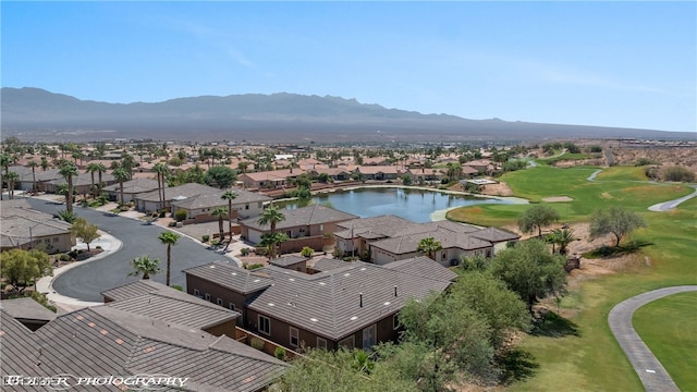 drone / aerial view with a water and mountain view