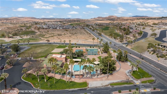 birds eye view of property with a mountain view