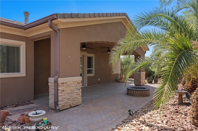 view of patio / terrace featuring ceiling fan