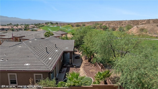 birds eye view of property with a mountain view