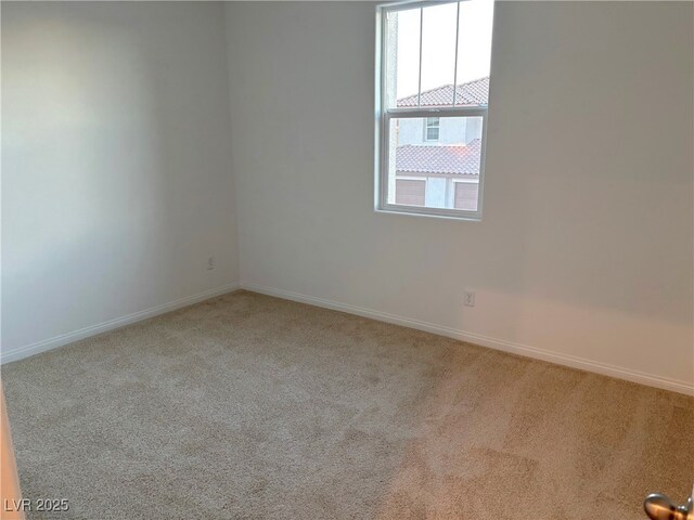 empty room with light colored carpet