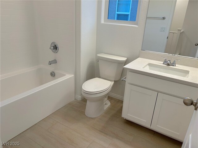 full bathroom featuring vanity,  shower combination, and toilet