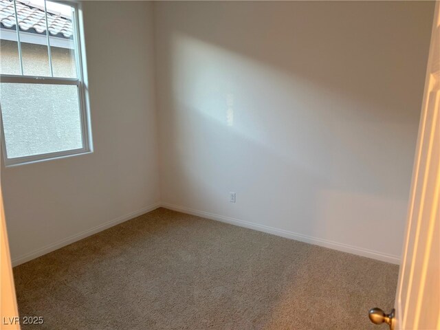 empty room with carpet flooring