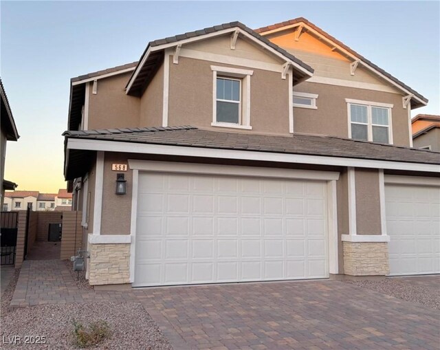 view of front of property with a garage