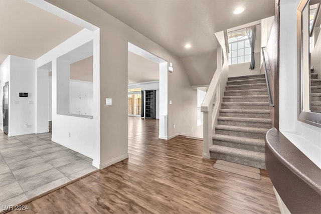 stairway featuring hardwood / wood-style floors