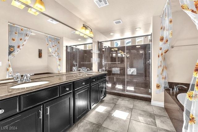 bathroom featuring vanity, tile patterned floors, and separate shower and tub