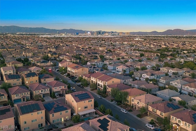 birds eye view of property with a mountain view