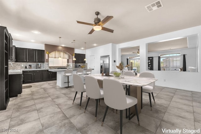 dining area with ceiling fan