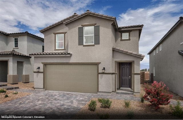 mediterranean / spanish-style house featuring a garage