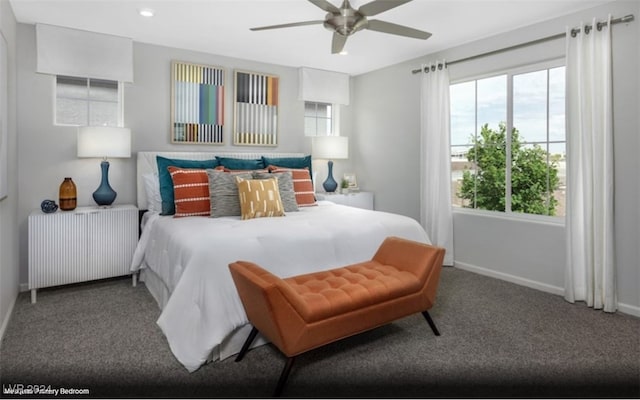 carpeted bedroom featuring radiator heating unit and ceiling fan